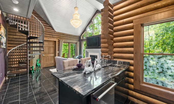 Logan Cabin | Paris Art Deco-Romanic-Opulent-Massage Chair-Sauna-Hot Tub-Kayaks-FireTable