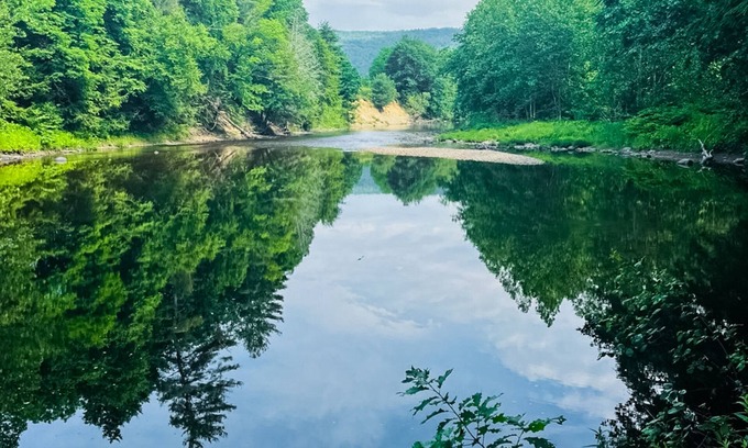 Newfane House | Peaceful riverfront house, dog-friendly, woodstove, decks, bbq, firepit, dock