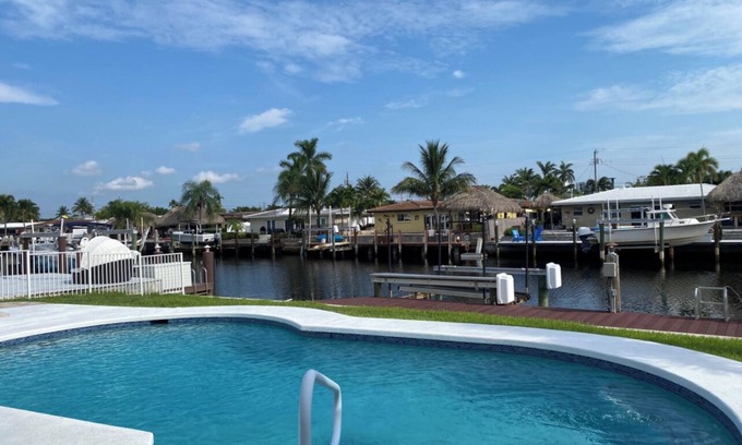 Garden Isles House | Peaceful, Serene Waterfront- Jacuzzi Heated Pool and BBQ Grill
