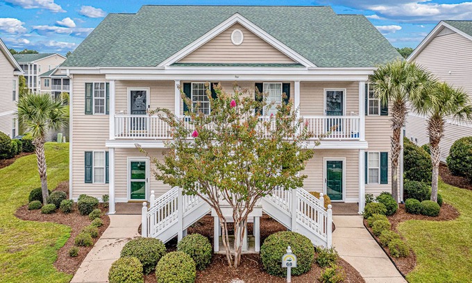 Sunset Beach Condo | Pond-front condo near beach with balcony, pool, & hot tub - snowbird-friendly