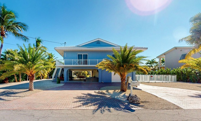 Marathon House | Pristine, updated retreat with private pool, screened deck, dock, & pool table