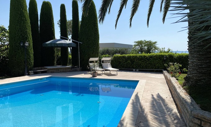 Montioni Apartment | Private pool & palm garden. Villa Colombara with lake view