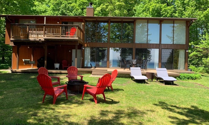 Suttons Bay House | Private Suttons Bay Waterfront Home with Hot Tub, Sauna and Central Air!