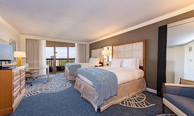 Pelican Bay Resort | Relax in Three Relaxing Rooms with Balcony, Beach & Outdoor Pool Access