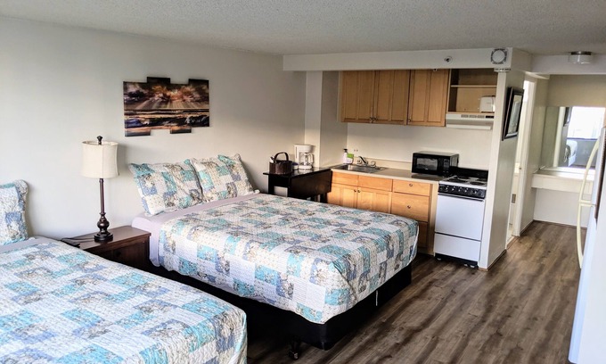 McCully - Moiliili Hotel | renovated studio room with two queen beds, full kitchen and full bath
