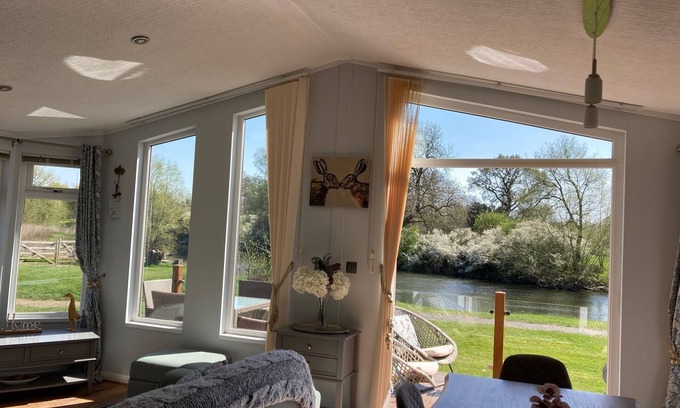 Tiddington House | River Retreat Lodge is front line with panoramic views over the river Avon.
