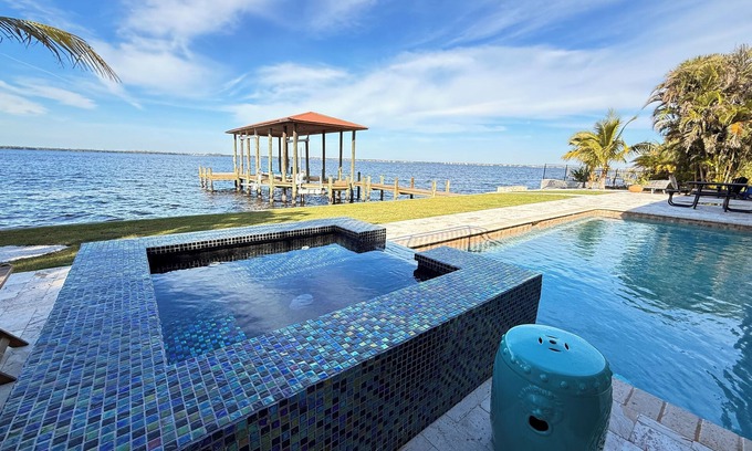 Riverside Park Villa | Riverfront 5 bedrooms, 5 baths , pool , spa , beach , dock and stunning views !