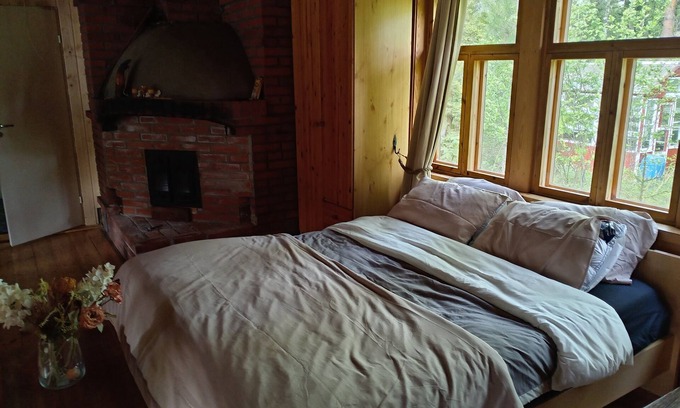 Aanekoski Ski Chalet | Riverfront cottage, sauna, hot tub, rowing boat, fishing, pets welcome.