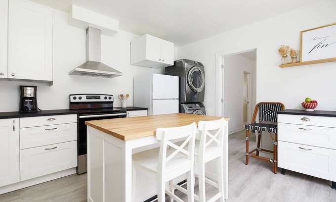 La Petite-Patrie Apartment | Rosemont Retreat: Chic 1BR Apt W/Terrace & AC on the Plaza St-Hubert