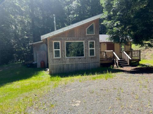 Shelter Cove House | Rustic River Retreat