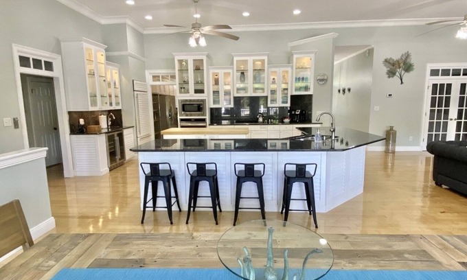 Gulf Breeze House | Salty Pelican Retreat on Canal with Pool, Elevator and Boat Dock