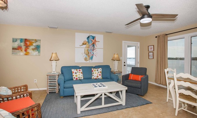 Gulf Shores Condo | Sea Oats E202 by ALBVR - Pet Friendly Direct Lagoon Front Renovated Condo and an easy walk to the Beach
