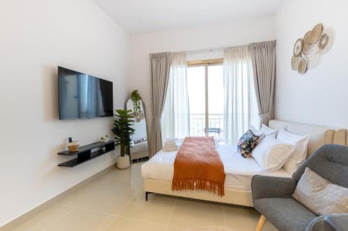 Jumeirah Village Circle Apartment | Serene studio apartment with Burj Khalifa view in Jumairah Village Circle JVC