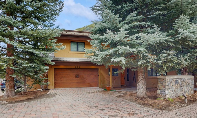 Warm Springs House | Ski-in/ski-out chalet with fireplace, furnished deck, & alfresco dining