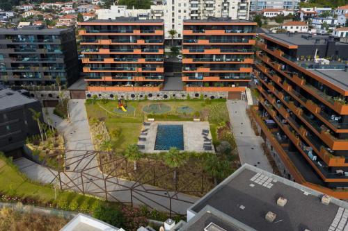 Sao Martinho Apartment | Sky-High Elegance Top-Floor Views of City, Ocean & Sunrise