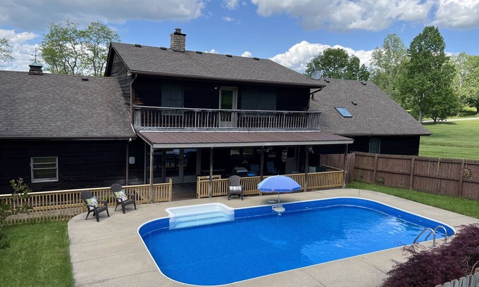 Keene House | Spacious family Lodge with solar heated pool, hot tub, fire pit and EV charger.
