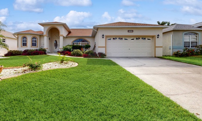 Biggar Villa | Spacious Lakefront Home with a Screened-In Pool in Exclusive Community