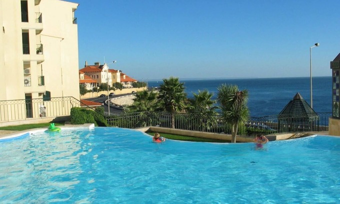 Parede Apartment | Spacious luxury apartment with 180° ocean view, pool, seafront beach