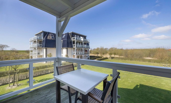 Wremen Apartment | Strandnahe, Hundefreundliche Ferienwohnung mit Sauna und Balkon mit Strandkorb