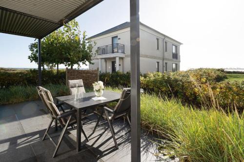 Fehmarnsund Apartment | Strandresidenz Vogelflug App 8