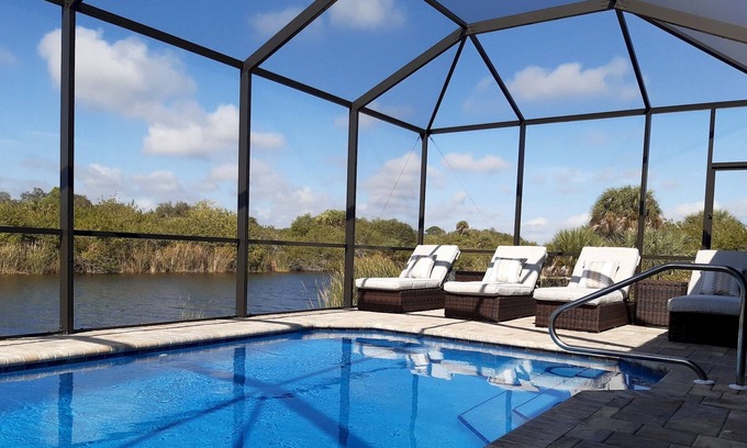 South Gulf Cove Villa | Stunning home, pool overlooking river, free wifi, bikes, BBQ. Near beaches