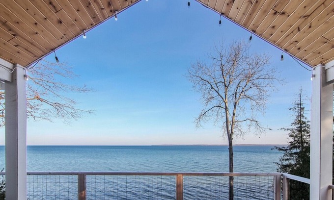 Suttons Bay House | Stunning Lakefront Home With Dock and Boat Lift