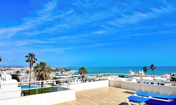 Patio Condo | Stunning views of Sunrise & Sunset WindMill Rooftop Condo by BeCherish