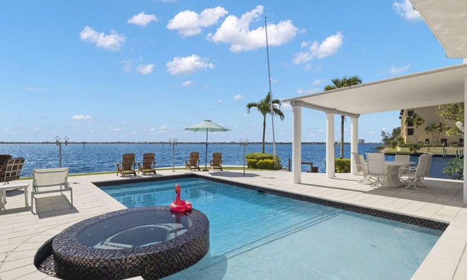 Caloosahatchee House | Stunning Waterfront Home With Heated Pool, Hot Tub, Boat Dock + Game Room