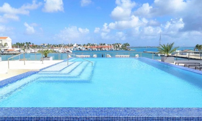 Oranjestad Apartment | Stylish luxury condo, central location, ocean view, pool, gym