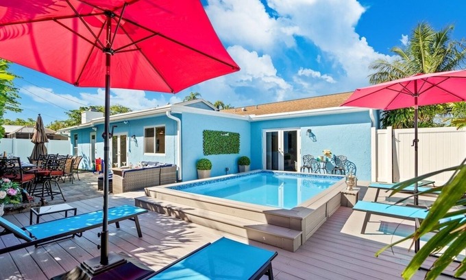 Tropic Palms House | Stylish Tropical Heated Pool Home, Large Deck, Pool Table, Pac-Man, Games