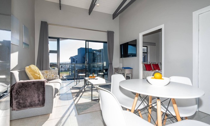 Mykonos Apartment | Stylish Urban Stay | Balcony | Lagoon View