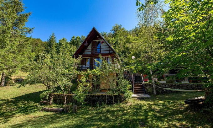 Zlobin House | Surrounded by pine trees is this small cottage.