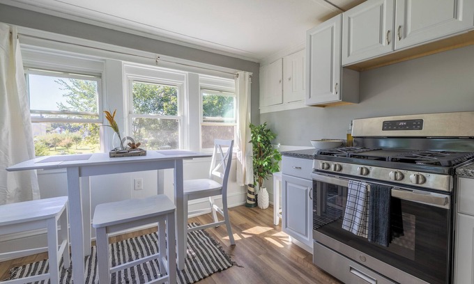 Warwick Apartment | Take in great views of the cove/marina while enjoying a meal!