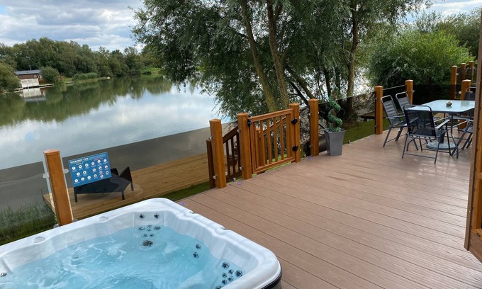 Tattershall Cabin | The Indulgence Lakeside Lodge is prime location with private fishing peg, sunken hot tub on Osprey