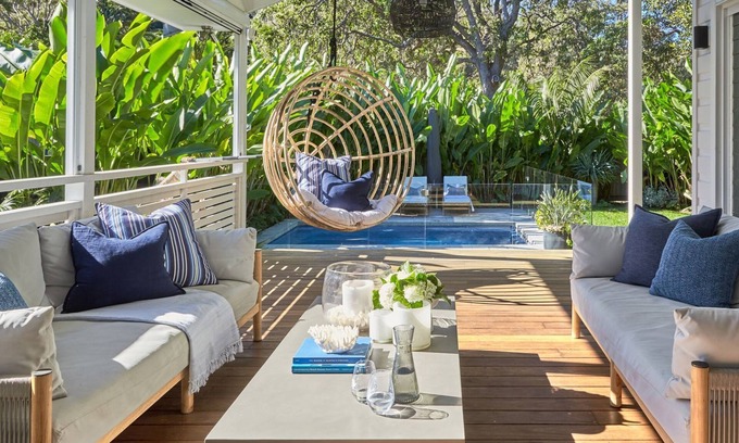 Palm Beach House | This home matches quaint beachside charm with luxurious comfort.