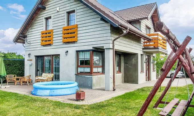 Lebcz House | This modern vacation home is located in the northeast of Poland with a garden, playroom and family-f