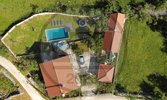 Lovrec House | This spacious vacation home is located on a large plot in the idyllic rural area of Dalmatian Zagora