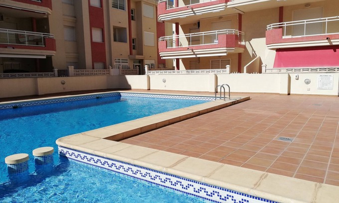 Xeraco Beach Apartment | Three bedrooms, garage, pool and large terrace with awnings!