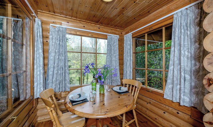 Westleigh Ski Chalet | Timber lodge set in an elevated position with views of the lake.