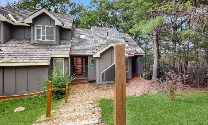 White Haven House | Treetop condo near golf + skiing with deck, grill, fireplace, & washer/dryer