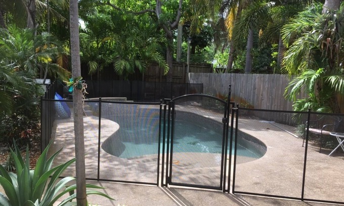 Mango Groves Cottage | Tropical Heated Pool home in fun beach side town Sleeps 8 Private