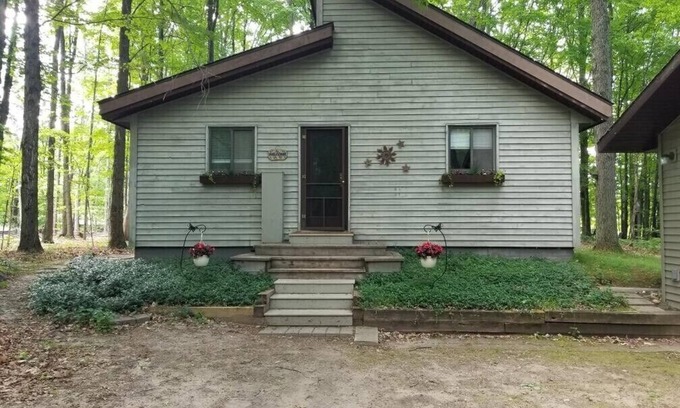 Thompsonville House | Up-north wood cabin, steps from river, 1 mile to Crystal Mtn Resort, free wifi.
