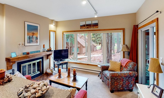 Maple City Condo | Updated, charming condo near Lake Michigan with porch, washer/dryer, fireplace
