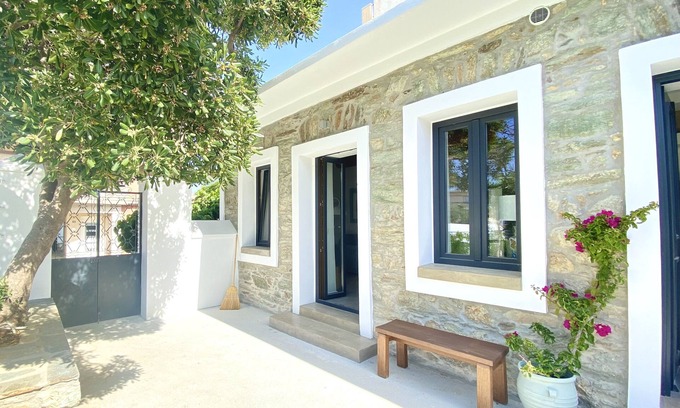 Karystos House | Urban Oasis: Stone House with pool & garden