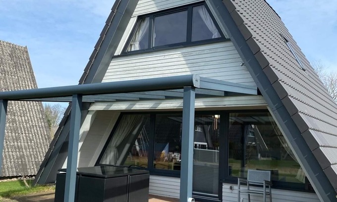 Damp House | Vacation home close to the beach with patio cover; fiberglass; garden; parking at the house