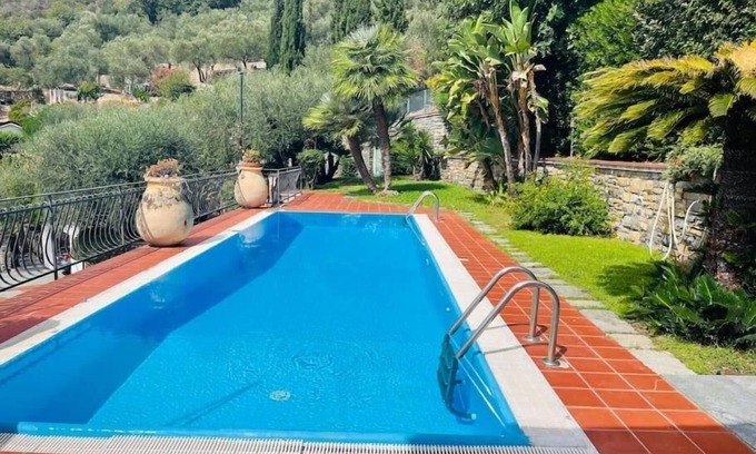 Imperia Apartment | Villa Le Anfore pool and park with sea view