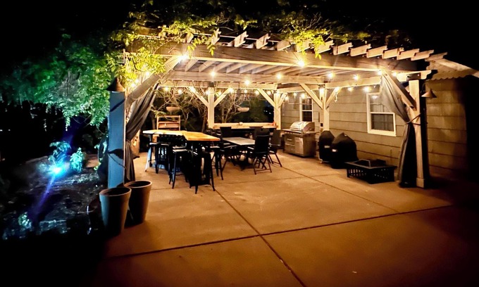 Medford Cottage | Wake to breathtaking sunrises over the rolling hills! Relax by the fire under the stars, & savor sunset dinners beneath fragrant wisteria pergola. Surrounded by wineries and minutes from historic Jacksonville, this retreat blends charm & convenience