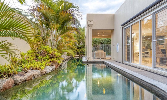 Pelican Waters House | Walk to Golf Course, Lagoon Pool, Coastal Lux Home