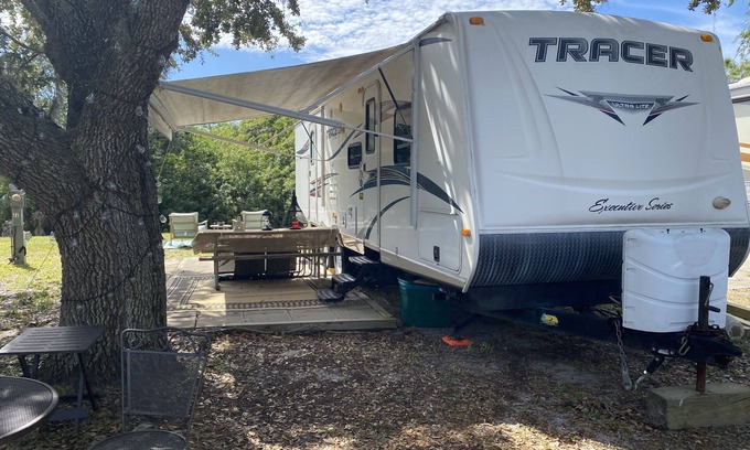 Riverwood RV Rental | Water Front Tracer RV by Glampers Camp