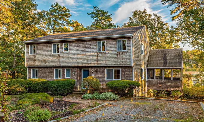 South Chatham House | Waterfront home with lovely lake views, great deck, sun porch & fireplace